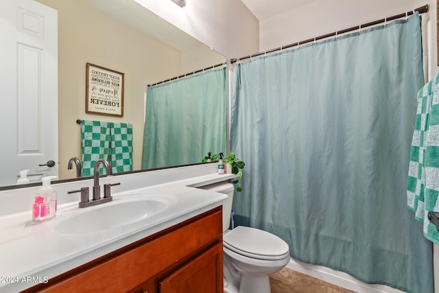 bathroom with toilet, shower / bath combo, and vanity