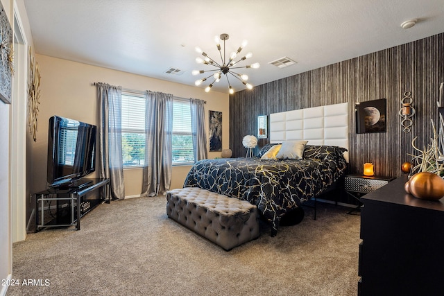 carpeted bedroom with an inviting chandelier