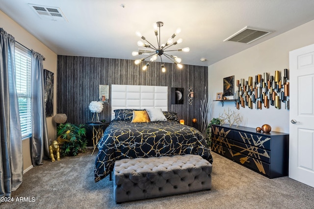 bedroom with a chandelier and carpet floors