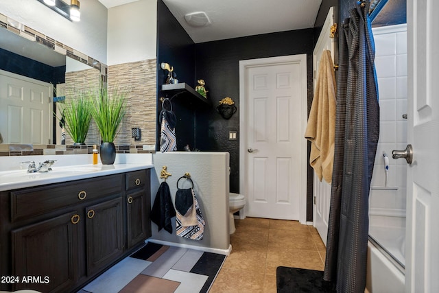 bathroom featuring a shower with shower curtain, vanity, toilet, and tile patterned floors