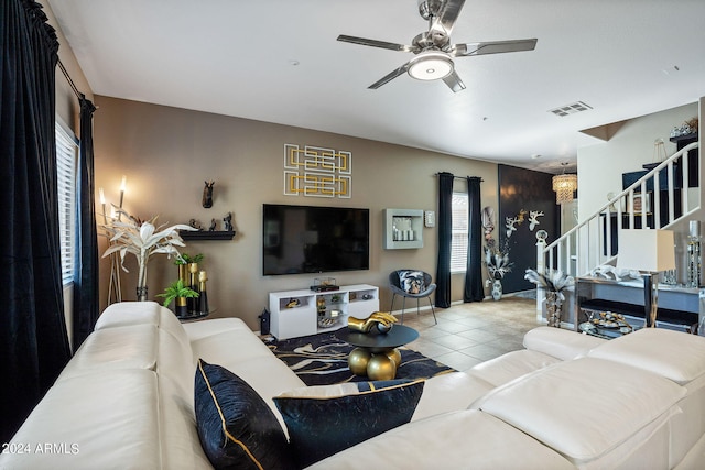 living room featuring ceiling fan and light tile patterned floors