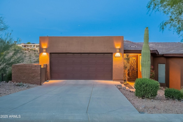 16336 E Ridgeline Dr, Fountain Hills, AZ 85268 - view of front of house featuring stucco siding, concrete driveway, and a garage