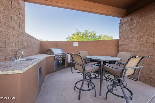 16336 E Ridgeline Dr, Fountain Hills, AZ 85268 - view of patio / terrace featuring grilling area, outdoor dining space, exterior kitchen, and a sink