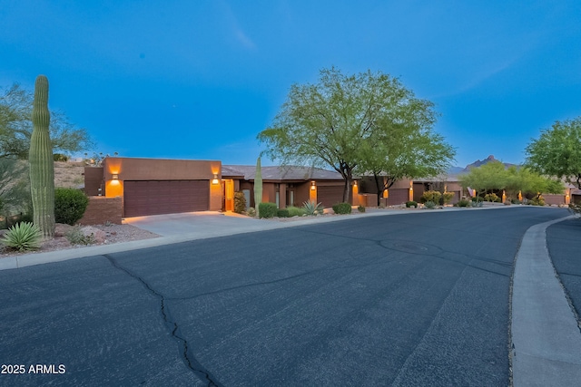 16336 E Ridgeline Dr, Fountain Hills, AZ 85268 - view of front of property featuring stucco siding, an attached garage, and driveway