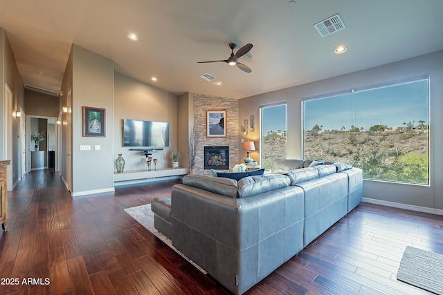 16336 E Ridgeline Dr, Fountain Hills, AZ 85268 - living room with vaulted ceiling, baseboards, visible vents, a ceiling fan, and a stone fireplace