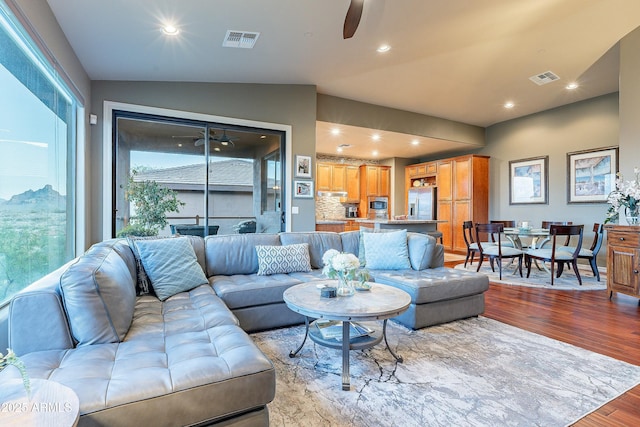 16336 E Ridgeline Dr, Fountain Hills, AZ 85268 - living area with ceiling fan, lofted ceiling, visible vents, and light wood-type flooring