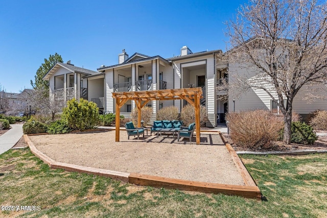 4343 E Soliere Ave Unit 2070, Flagstaff, AZ 86004 - rear view of property with a chimney, an outdoor hangout area, and a patio