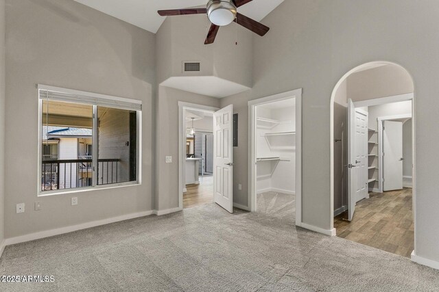 4343 E Soliere Ave Unit 2070, Flagstaff, AZ 86004 - unfurnished bedroom with a walk in closet, baseboards, visible vents, and carpet