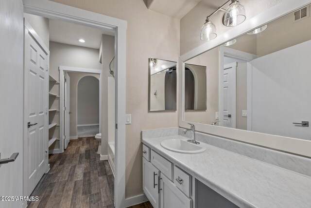 4343 E Soliere Ave Unit 2070, Flagstaff, AZ 86004 - bathroom with baseboards, visible vents, vanity, and wood finished floors