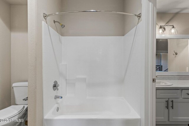 4343 E Soliere Ave Unit 2070, Flagstaff, AZ 86004 - full bath featuring bathing tub / shower combination, a textured wall, toilet, and vanity