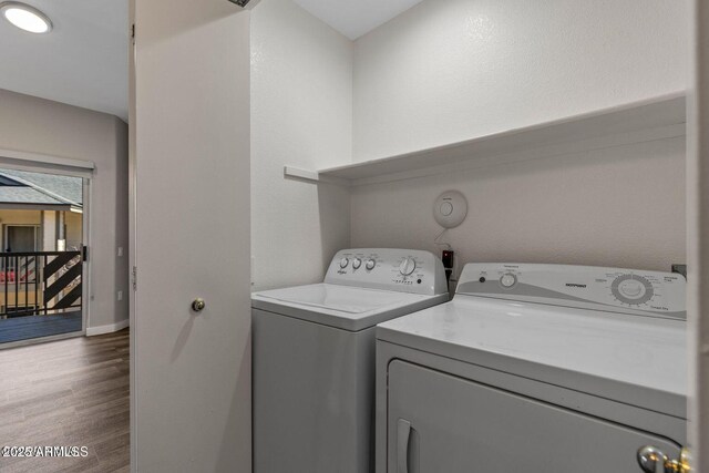 4343 E Soliere Ave Unit 2070, Flagstaff, AZ 86004 - clothes washing area featuring dark wood finished floors, independent washer and dryer, laundry area, and baseboards