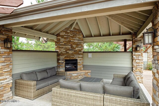 4343 E Soliere Ave Unit 2070, Flagstaff, AZ 86004 - view of patio featuring an outdoor living space with a fireplace and a gazebo
