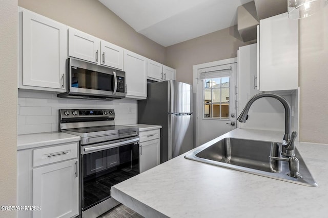 4343 E Soliere Ave Unit 2070, Flagstaff, AZ 86004 - kitchen with decorative backsplash, light countertops, a sink, and stainless steel appliances