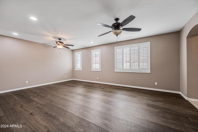 spare room featuring dark hardwood / wood-style floors