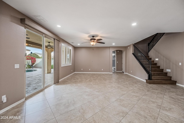 interior space with ceiling fan