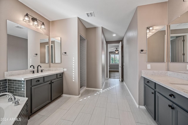 bathroom with vanity, a tub to relax in, and ceiling fan