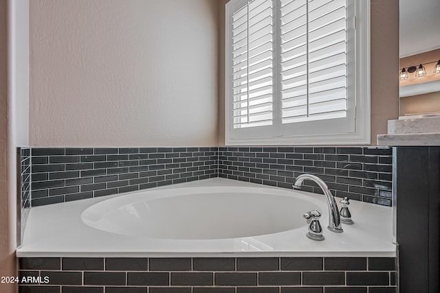 bathroom with a relaxing tiled tub