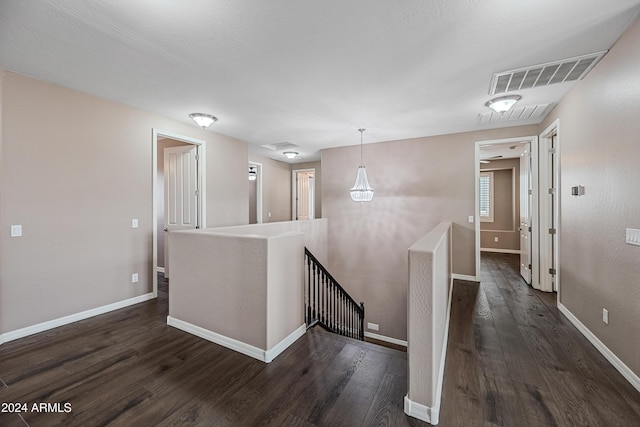 hallway featuring dark wood-type flooring