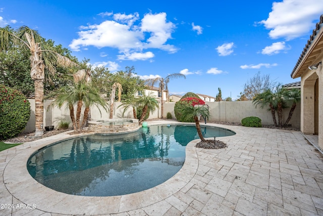 view of pool featuring an in ground hot tub and a patio