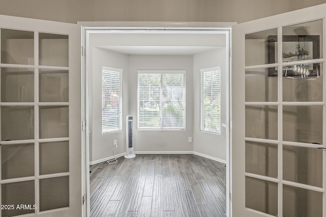 1482 S Banning St, Gilbert, AZ 85296 - unfurnished dining area featuring baseboards and wood finished floors