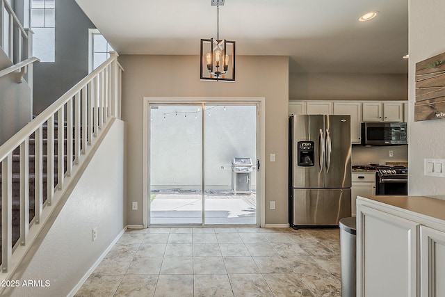 1482 S Banning St, Gilbert, AZ 85296 - kitchen featuring appliances with stainless steel finishes, white cabinets, baseboards, a chandelier, and pendant lighting