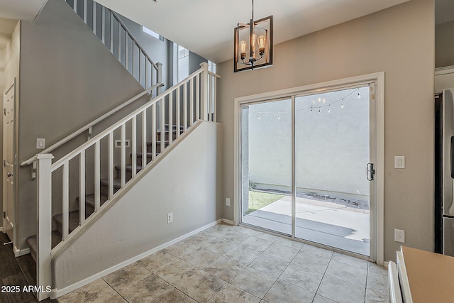 1482 S Banning St, Gilbert, AZ 85296 - doorway to outside featuring stairs, healthy amount of natural light, a chandelier, and baseboards