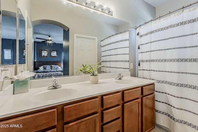 1482 S Banning St, Gilbert, AZ 85296 - ensuite bathroom featuring a ceiling fan, double vanity, and curtained shower