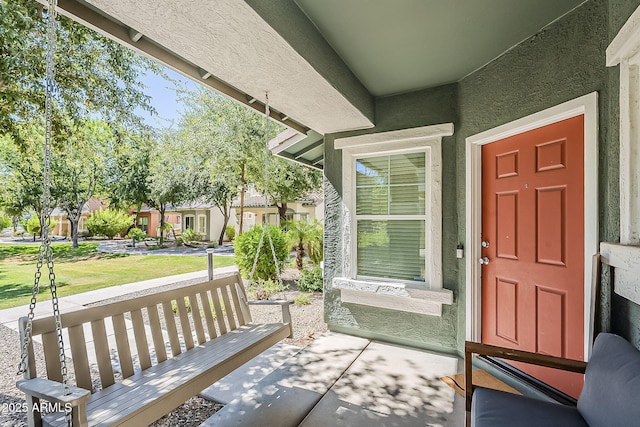 1482 S Banning St, Gilbert, AZ 85296 - doorway to property with covered porch and stucco siding