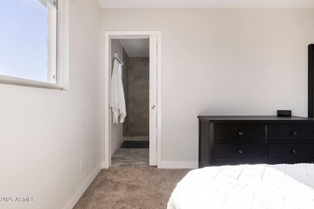 carpeted bedroom featuring ensuite bathroom