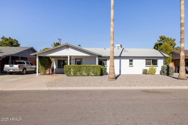 single story home with a carport