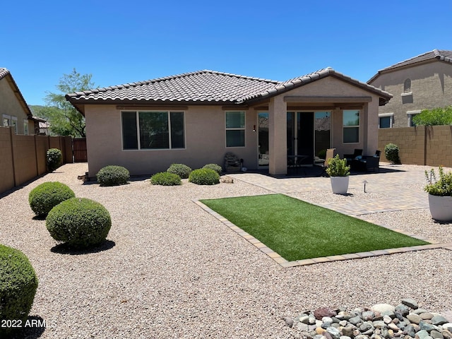 back of house featuring a patio