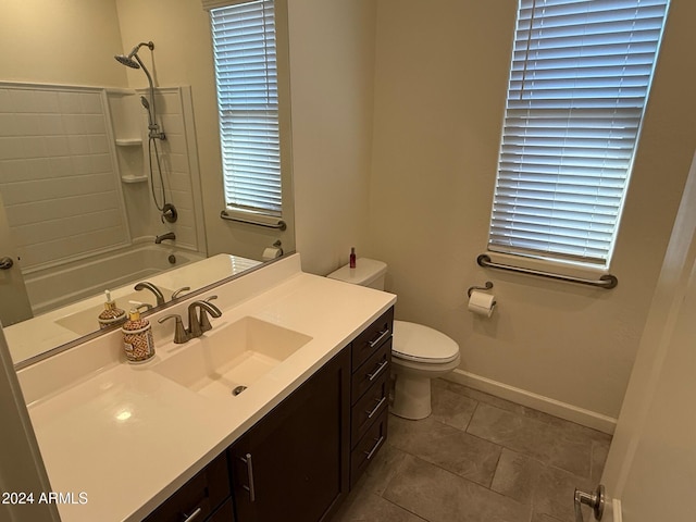 full bathroom with toilet, vanity, tile patterned floors, and shower / washtub combination