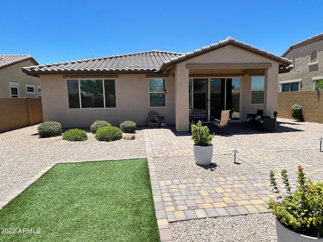 back of house featuring a patio