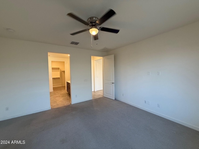 unfurnished bedroom featuring ceiling fan