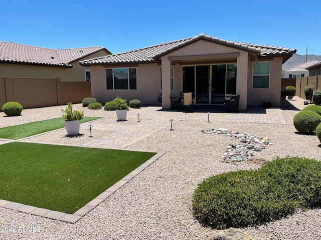 back of house with a patio area