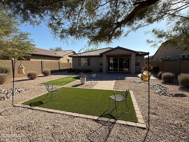 back of property with a patio area