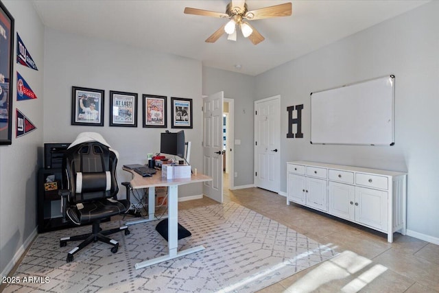 office area with light tile patterned flooring and ceiling fan