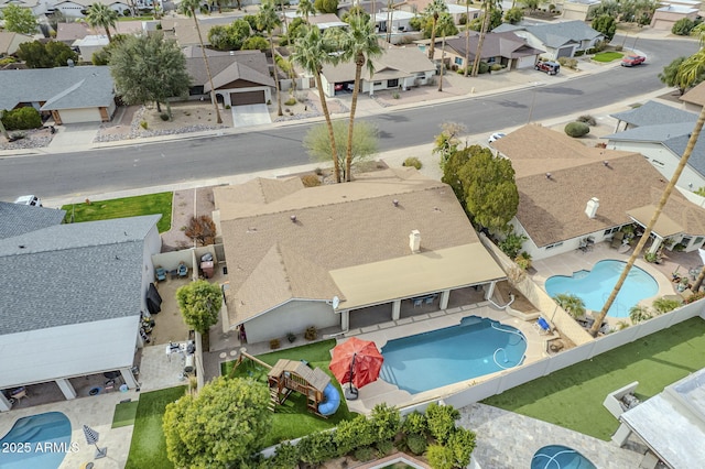 birds eye view of property with a residential view