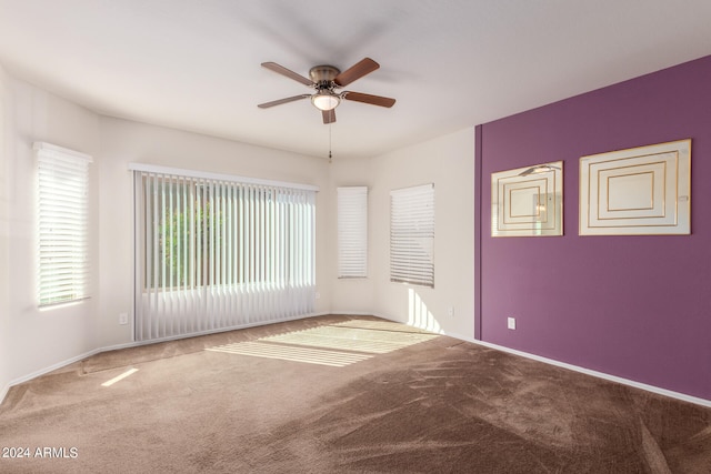 unfurnished room featuring carpet flooring and ceiling fan