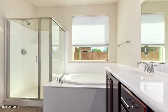 bathroom featuring vanity and plus walk in shower