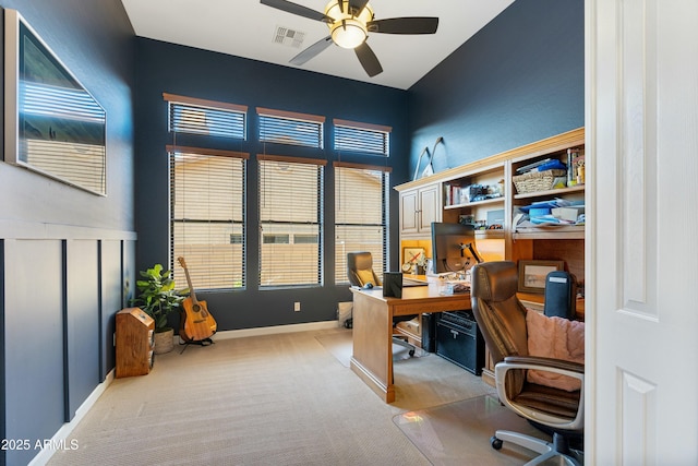 office space with plenty of natural light, light carpet, ceiling fan, and visible vents