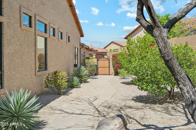 view of patio / terrace with fence and a gate