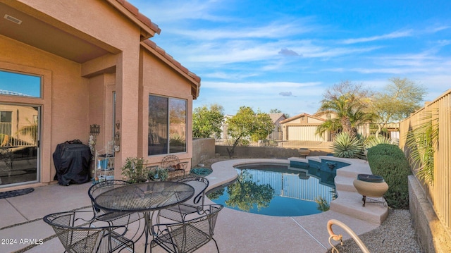 view of swimming pool with a patio area