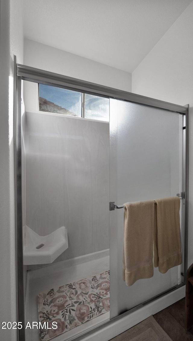 full bathroom featuring a stall shower