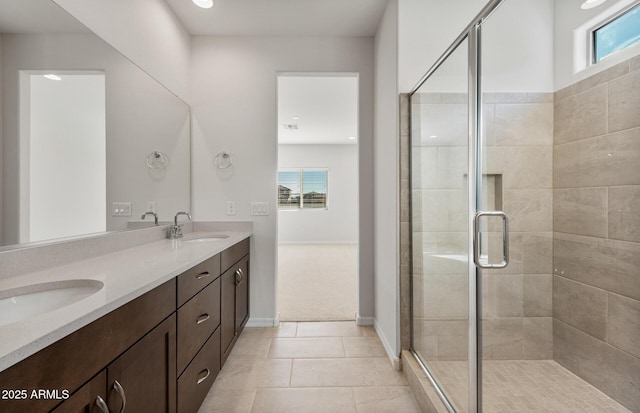 bathroom with vanity, tile patterned flooring, and a shower with shower door