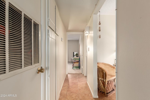 corridor featuring light tile patterned flooring