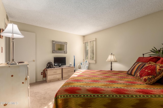 carpeted bedroom with a textured ceiling