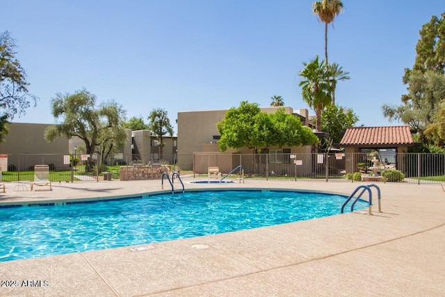 view of swimming pool featuring a patio