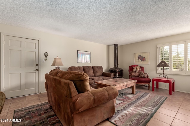 tiled living room featuring a textured ceiling