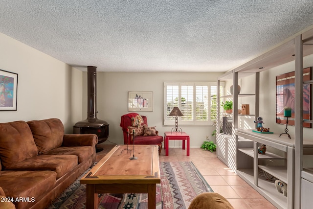 living room featuring light tile patterned flooring and a textured ceiling